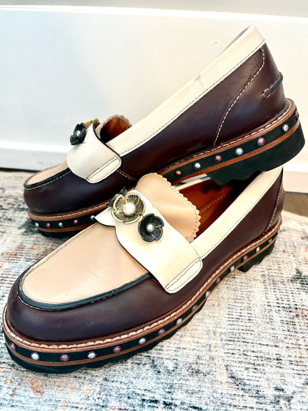 Coach Tan and White Flats with Stylish Metal Accents